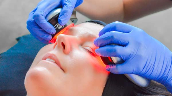 A dermapure physician treating a patient