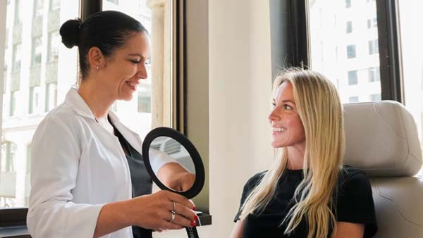A dermapure physician treating a patient