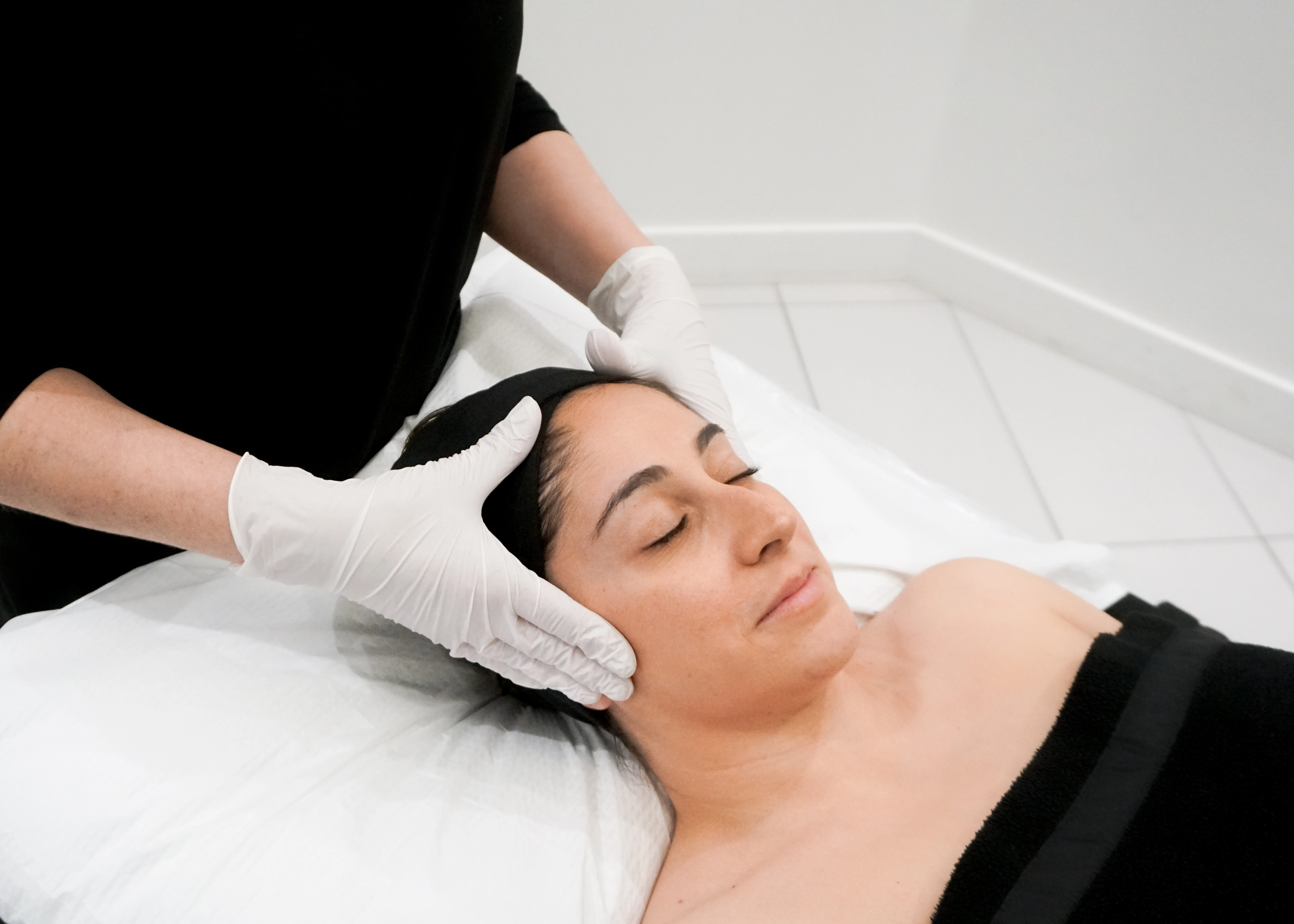 A dermapure physician treating a patient