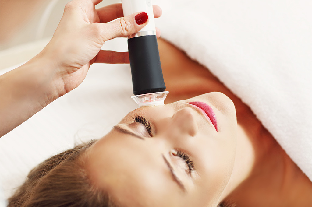 A dermapure physician treating a patient