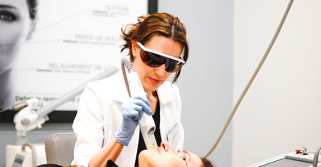 A dermapure physician treating a patient
