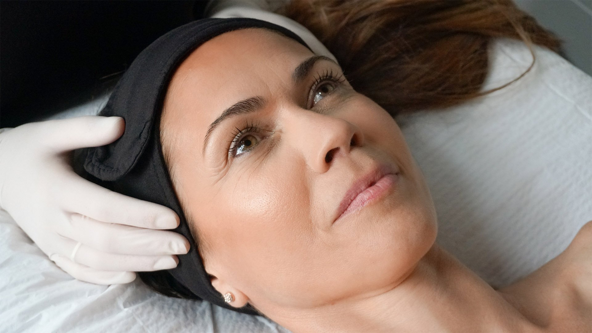 A dermapure physician treating a patient