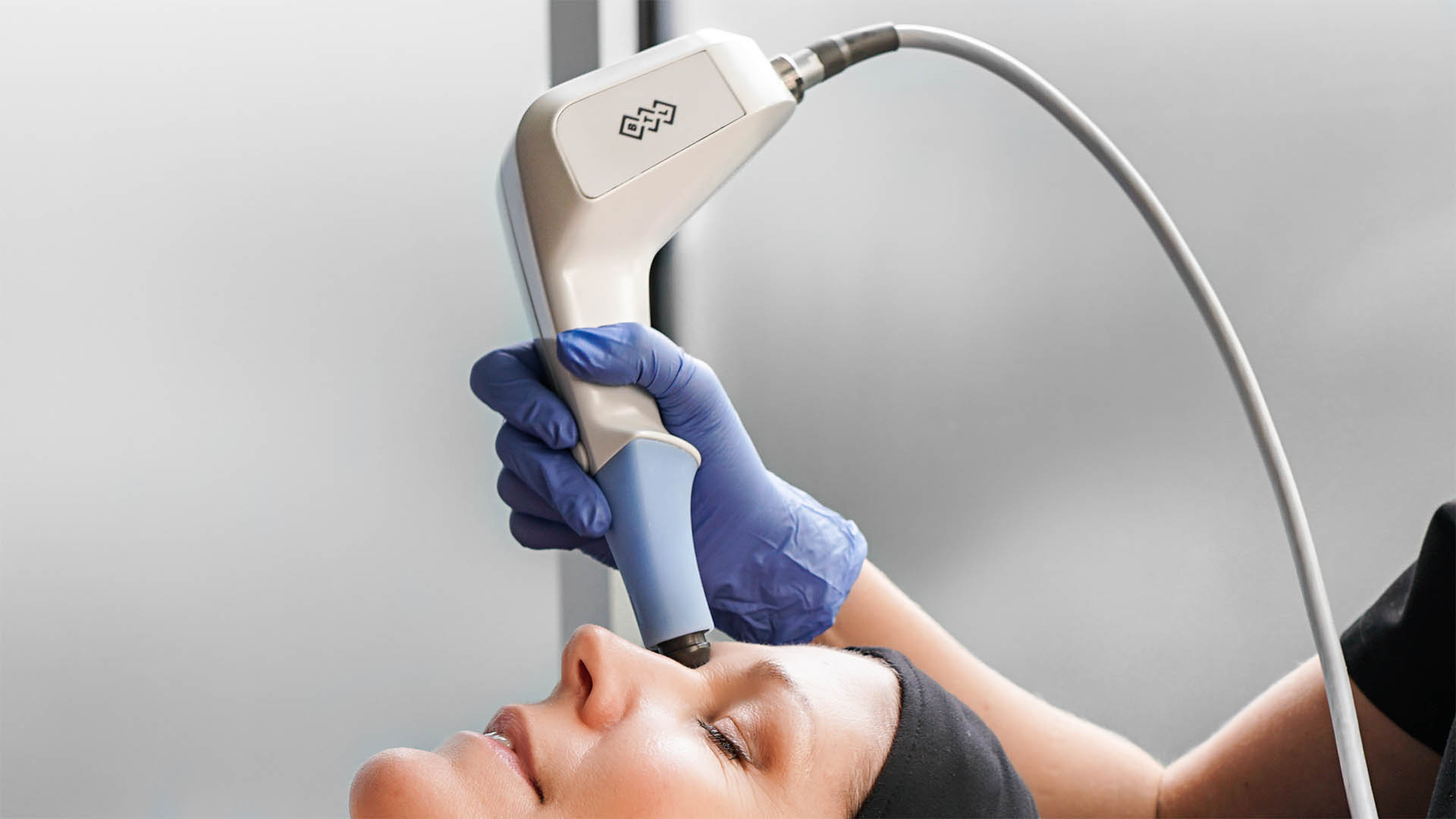 A dermapure physician treating a patient