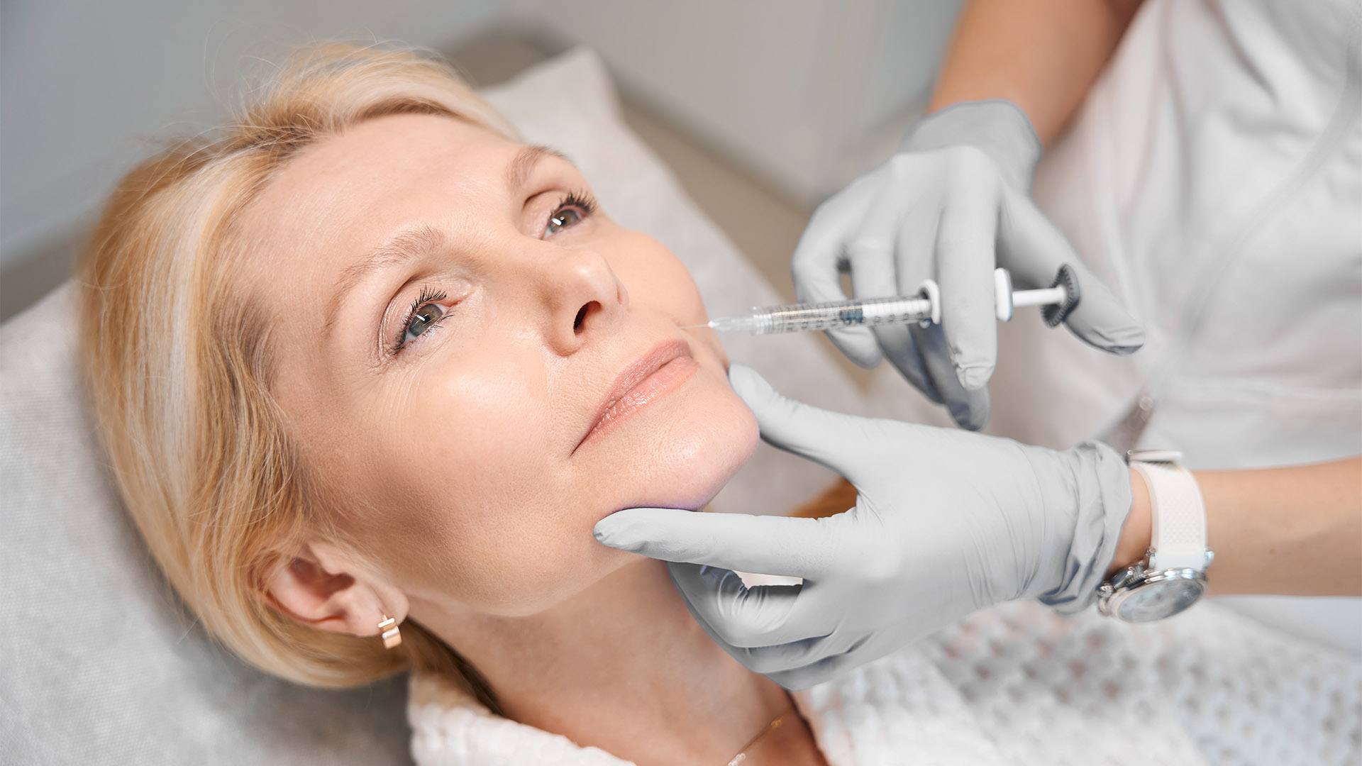 A dermapure physician treating a patient