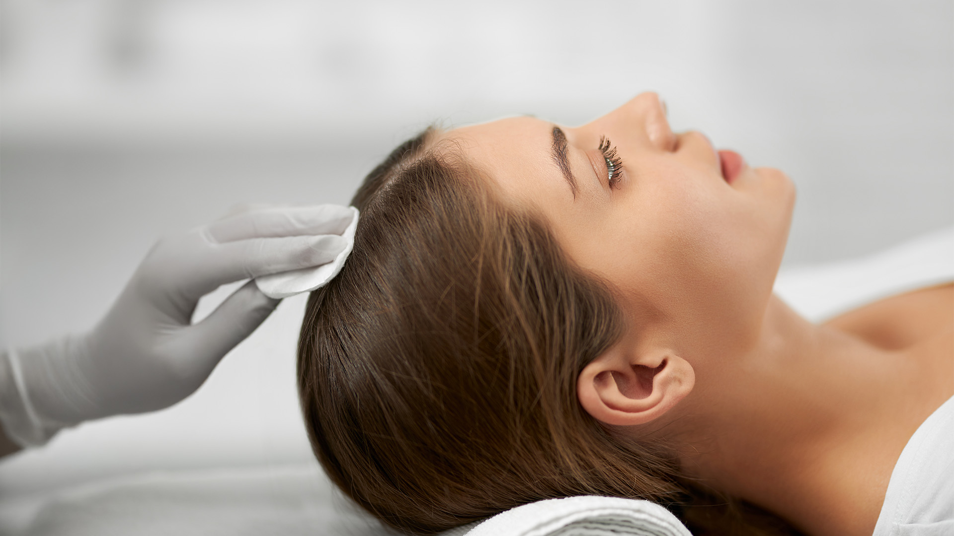 A dermapure physician treating a patient