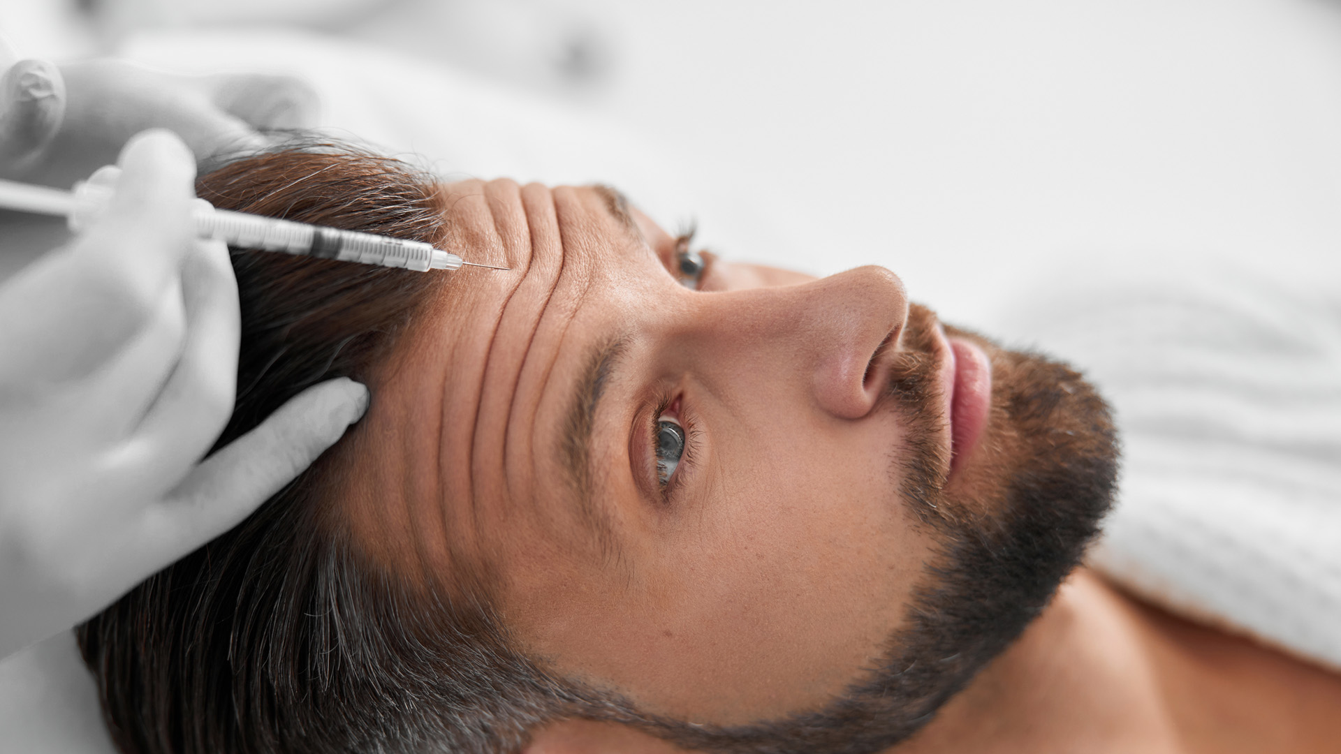 A dermapure physician treating a patient