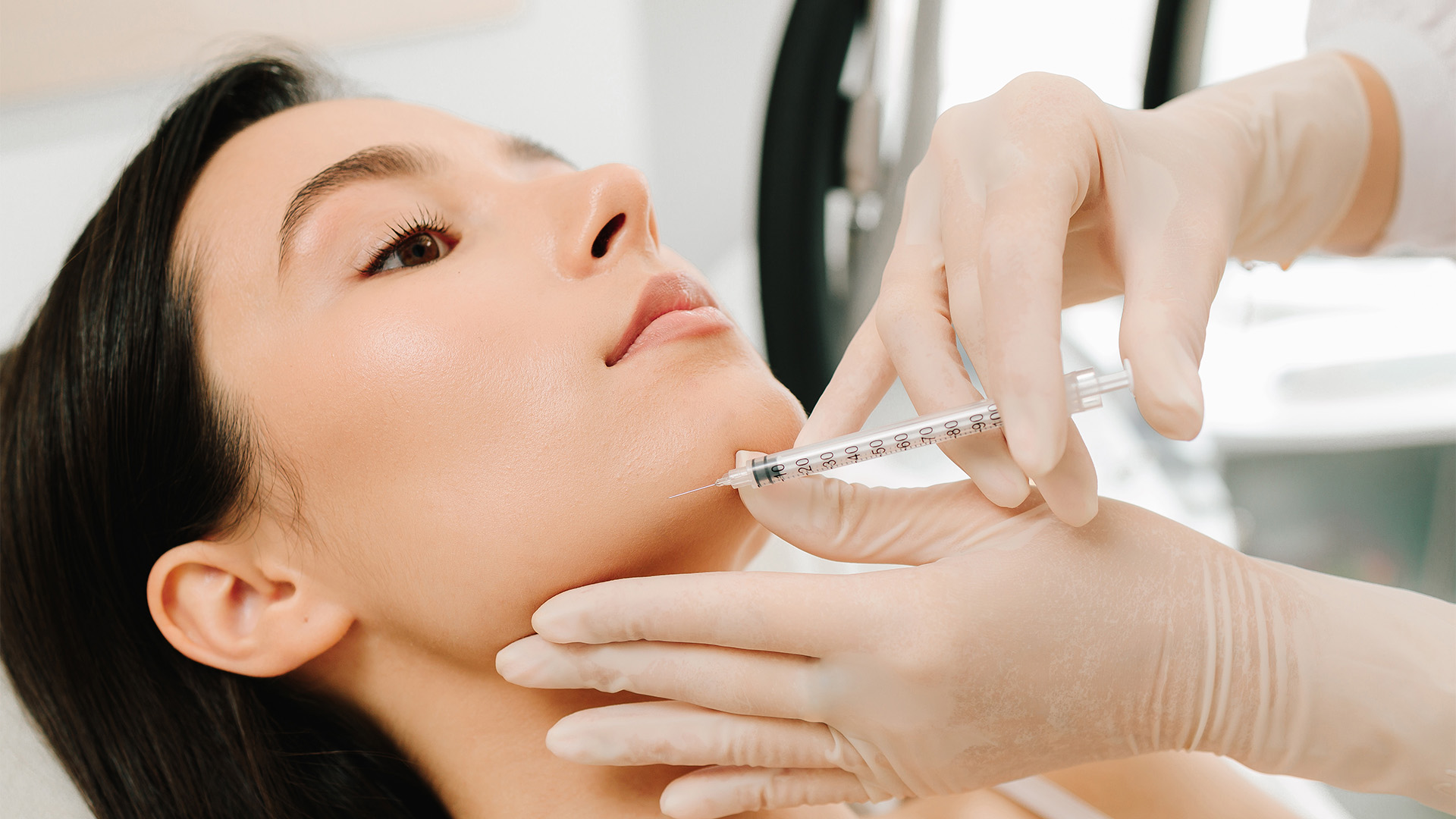 A dermapure physician treating a patient